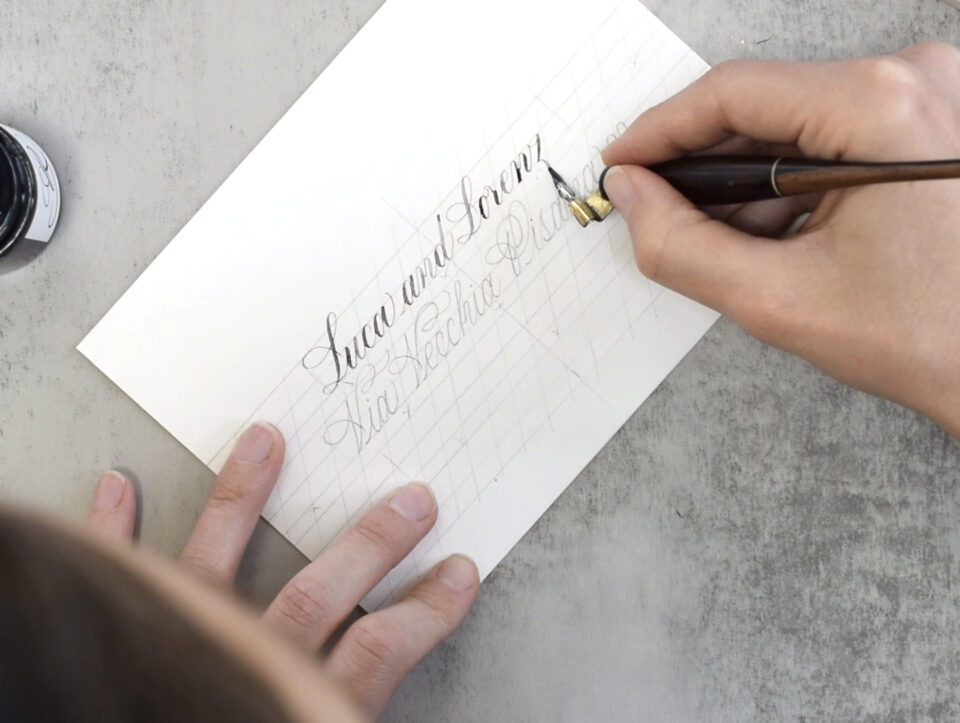 Using a pointed pen to write centered envelope calligraphy